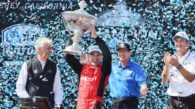 Will Power lifts the 2022 IndyCar championship trophy at Laguna Seca