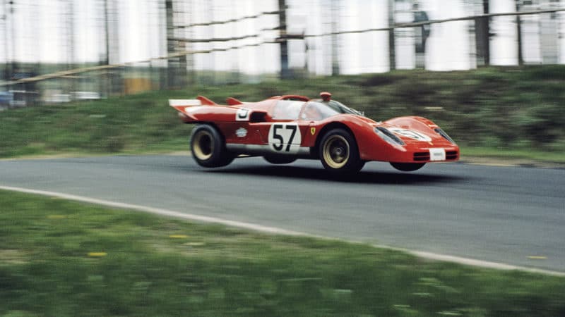 The Ferrari 512S was a tiring car to drive; the Porsche 917 was easier. Merzario takes to the air at the Nürburgring, 1970