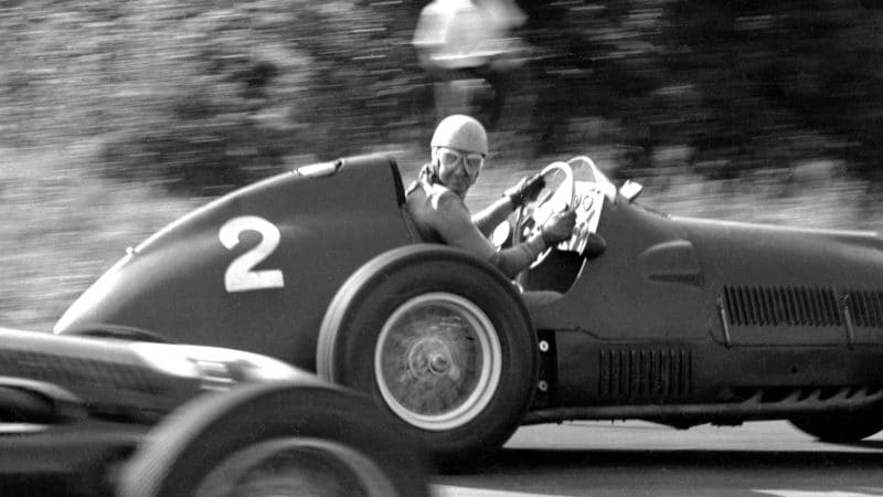 Alberto Ascari looks over his shoulder during the 1951 Italian Grand Prix