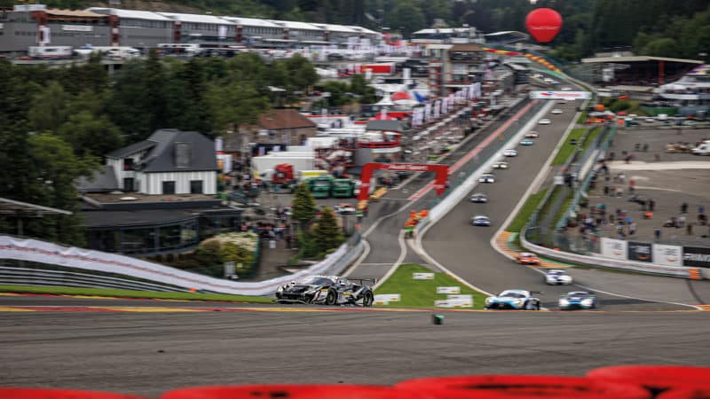 The Iron Lynx Ferrari roars up Eau Rouge