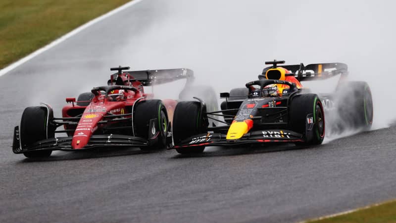 Charles Leclerc battles with Max Verstappen in the spray at the start of the 2022 Japanese Grand Prix