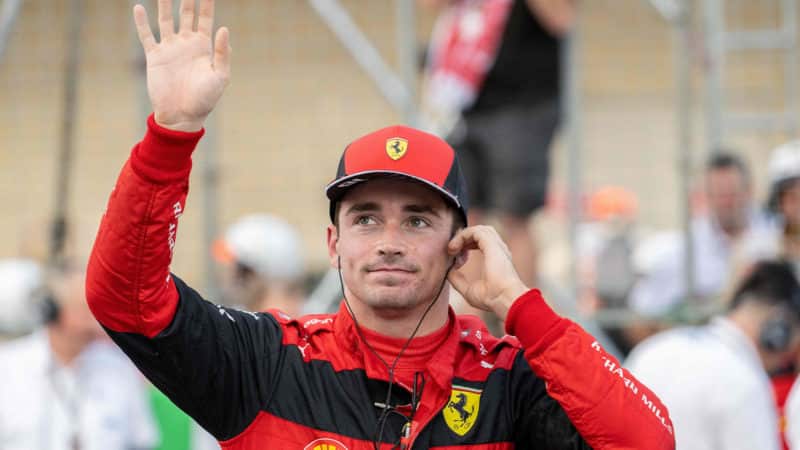 Charles Leclerc waves to the crowd at the 2022 US GP
