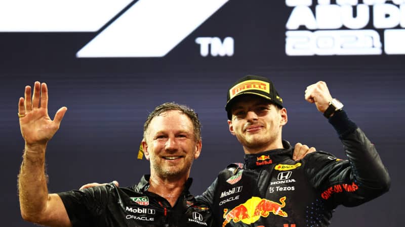 Christian Horner and Max Verstappen celebrate winning the 2021 f1 championship in Abu Dhabi