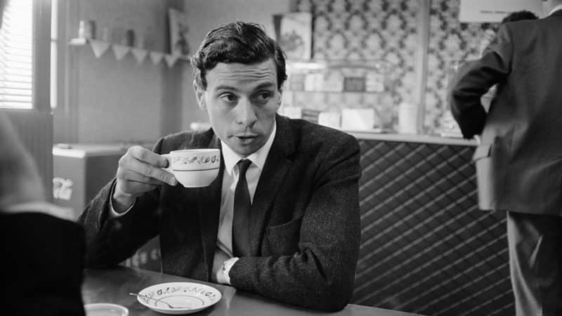 Jim Clark enjoying a cup of tea after becoming world champion