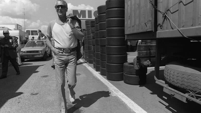 Paul Newman walks through the paddock at Le Mans in 1979