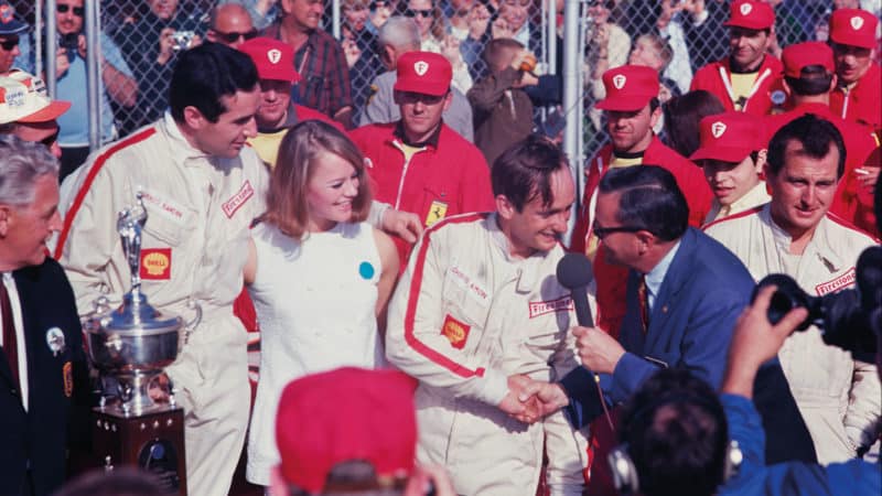 winning drivers Chris Amon, centre, and Lorenzo Bandini, left