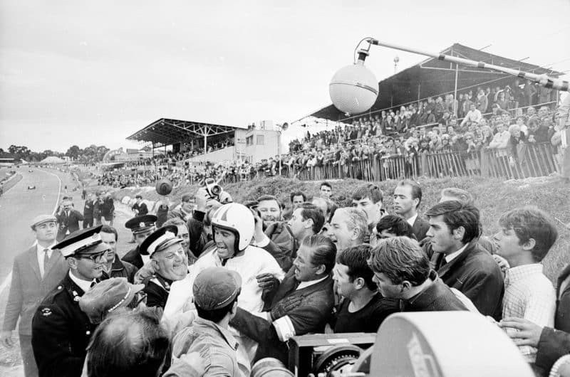 Garner at the centre of a tustle after climbing from his burning car at Brands Hatch in Grand Prix. Garner actually took to driving so well that he filled in for several other actors at the wheel while on set