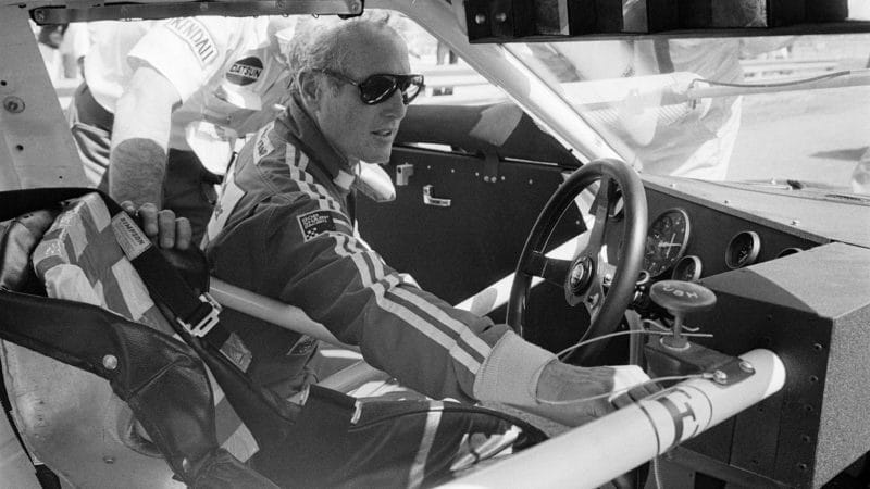 Paul Newman makes some last minute checks on his Bob Sharp Racing Datsun, before the start of the Los Angeles Times Grand Prix of Endurance at Riverside