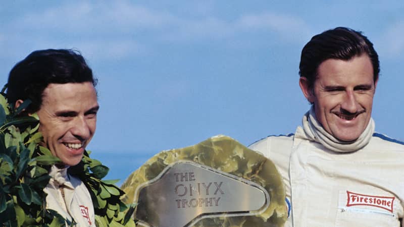 Jimmy Clark Smiling with Teammate Graham Hill