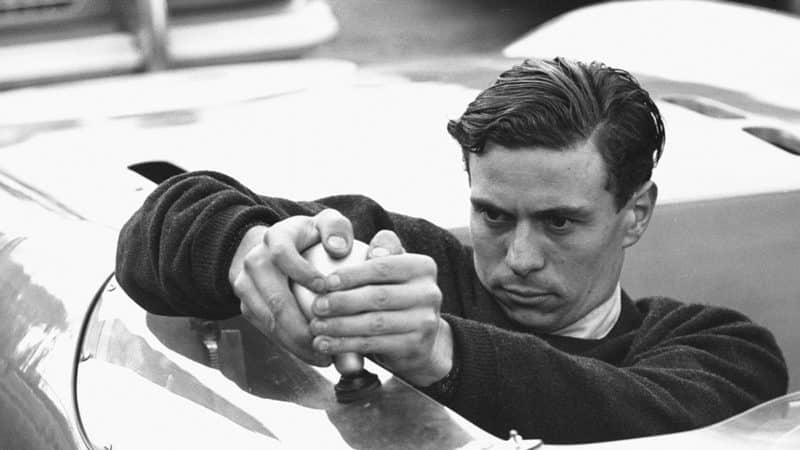 Jim Clark adjusts the mirror on his Lotus 23 before the start of the Autosport 3 hour endurance race at Snetterton. 29th