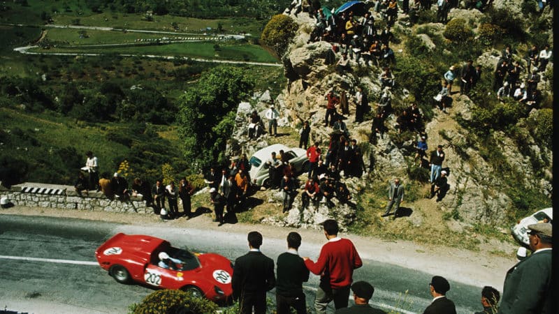 Spectators watch on during the 1965 race