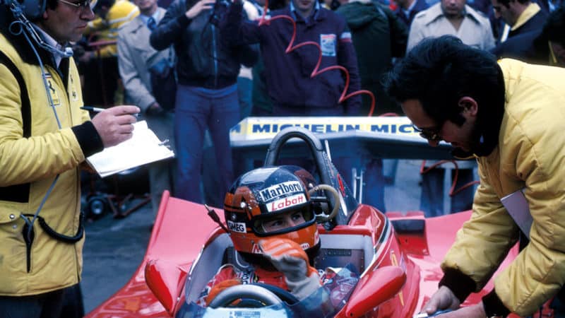 Forghieri talks with Gilles Villeneuve in his 312T4 at Zolder in 1979