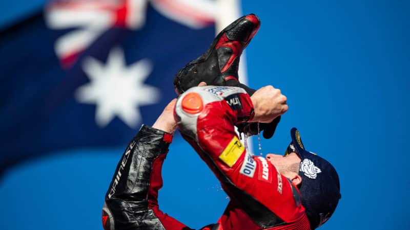 Jack Miller drinks champagne from his shoe after MotoGP win in Japan