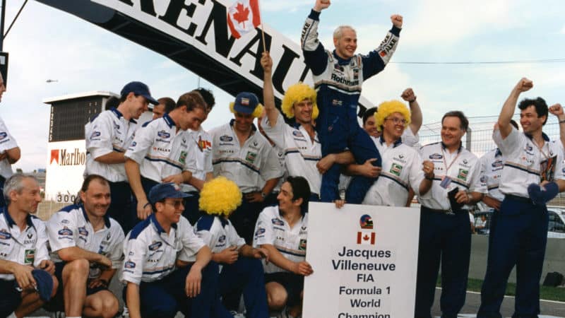 Jacques Villeneuve celebrates winning 1997 F1 championship with his Williams team