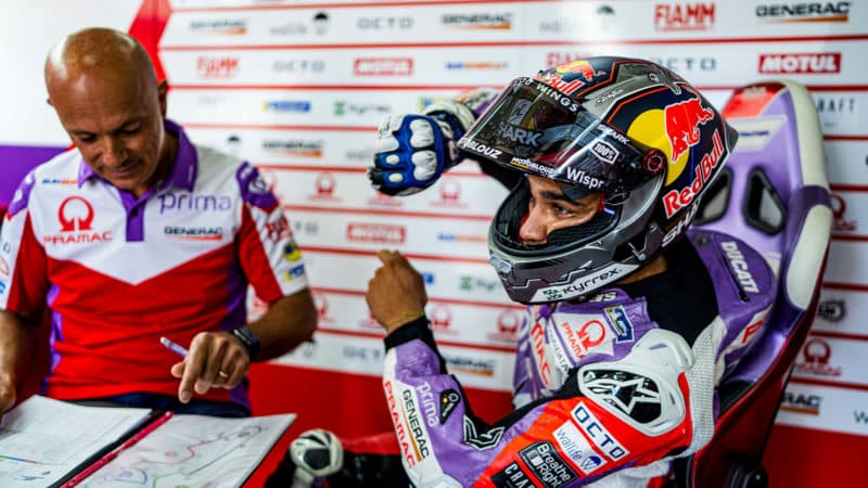 Jorge Martin demonstrating turning technique in his Pramac Ducati MotoGP garage