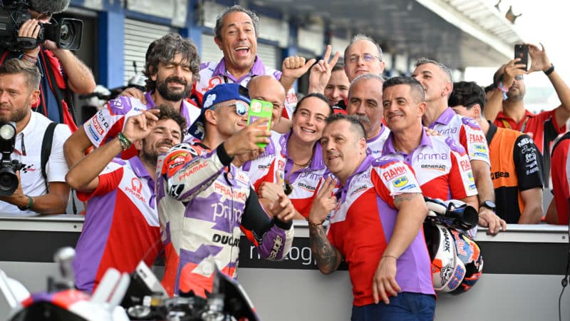 Jorge Martin takes a picture with Pramac Ducati team in 2022