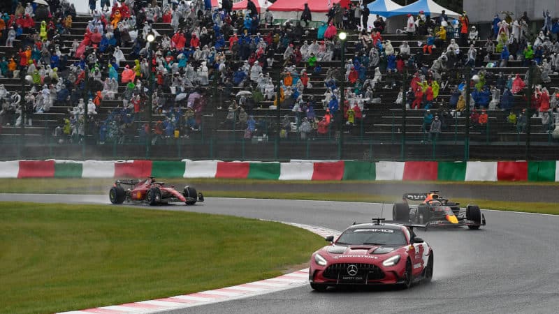 Max Verstappen and Charles Leclerc follow the safety car in the 2022 Japanese GP