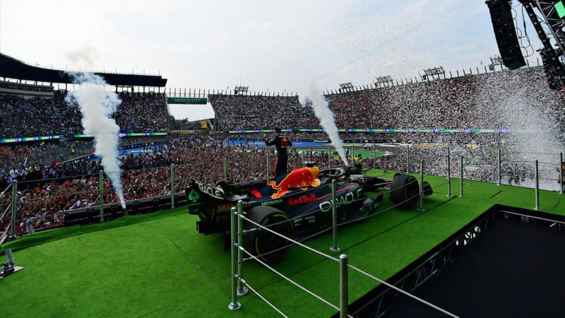 Max Verstappen celewbrates in front of stadium crowd at the 2022 Mexican Grand Prix