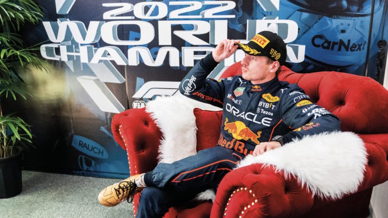 Max Verstappen sitting on a couch