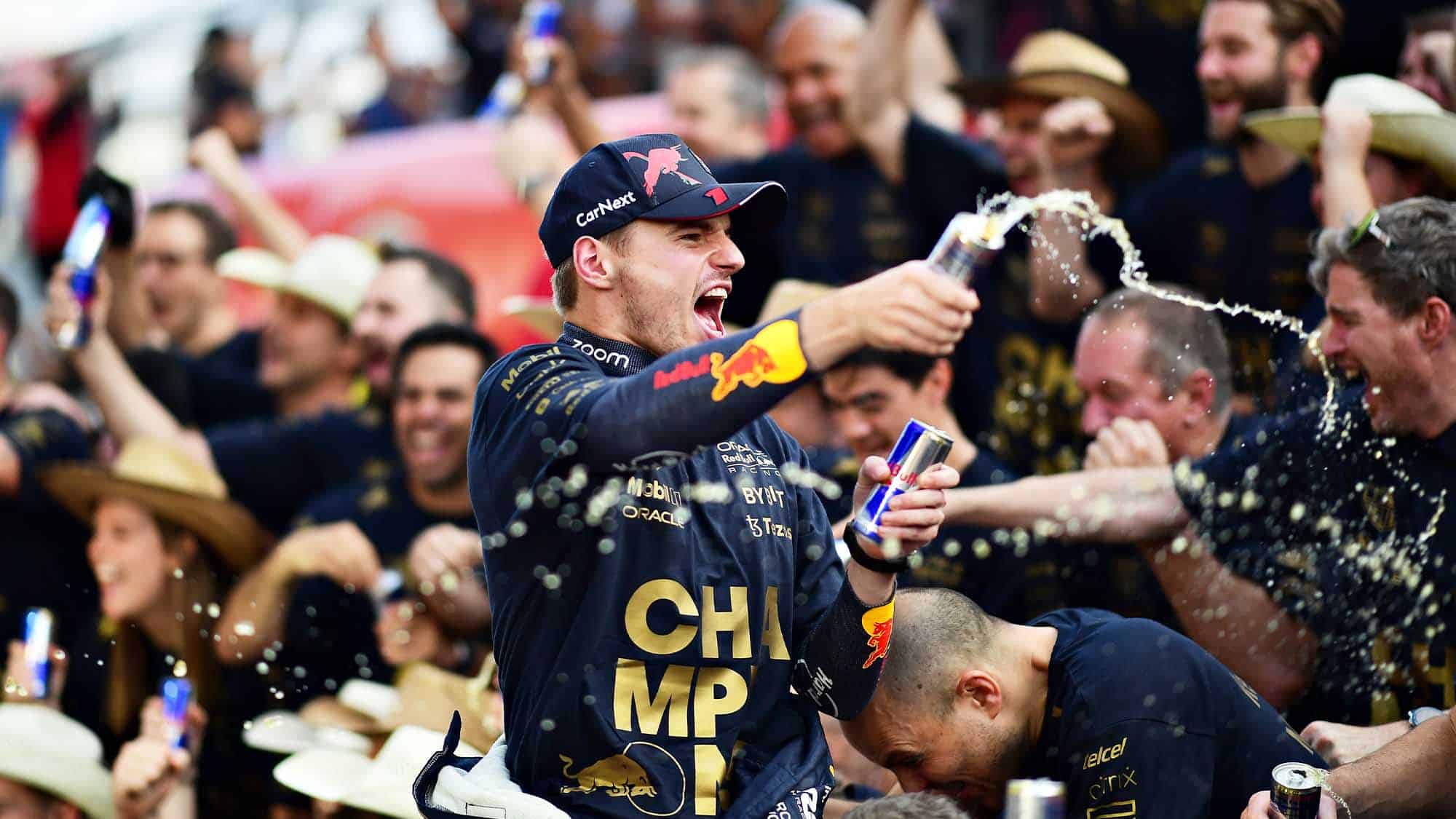 Max Verstappen sprays Red Bull as he celebrates securing the 2022 F1 constructors championship