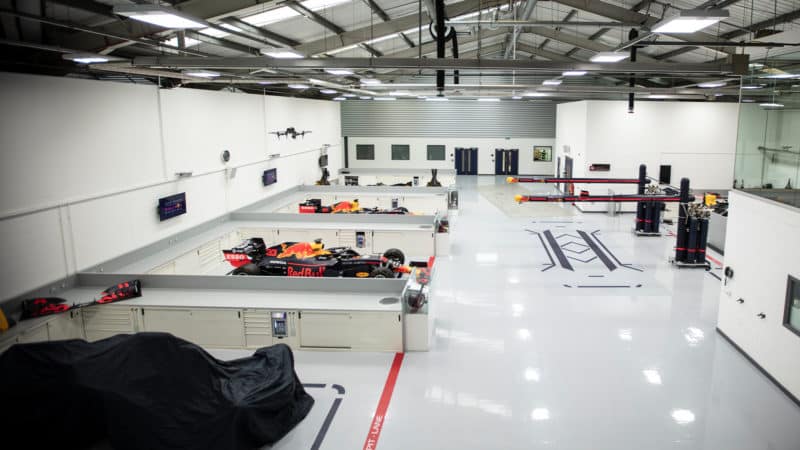 Red Bull F1 cars in bays at Milton Keynes factory