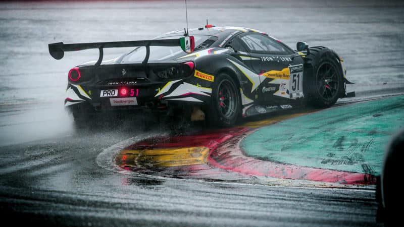 The Iron Lynx Ferrari in action in heavy rain at Spa