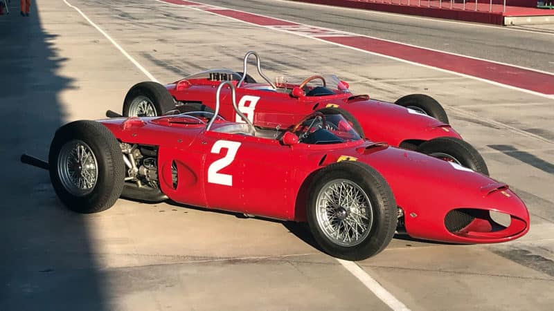 Two replica Ferraris in the Reims pit lane