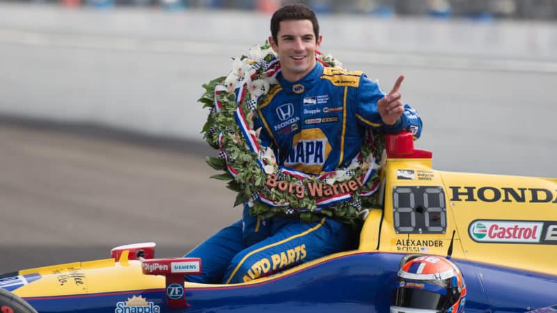 Alexander Rossi poses with his car after Indy 500 win