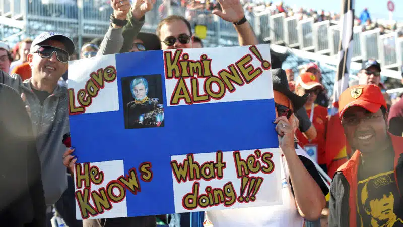 F1 fans hold up a Kimi Raikkonen leave me alone I know what Im doing flag
