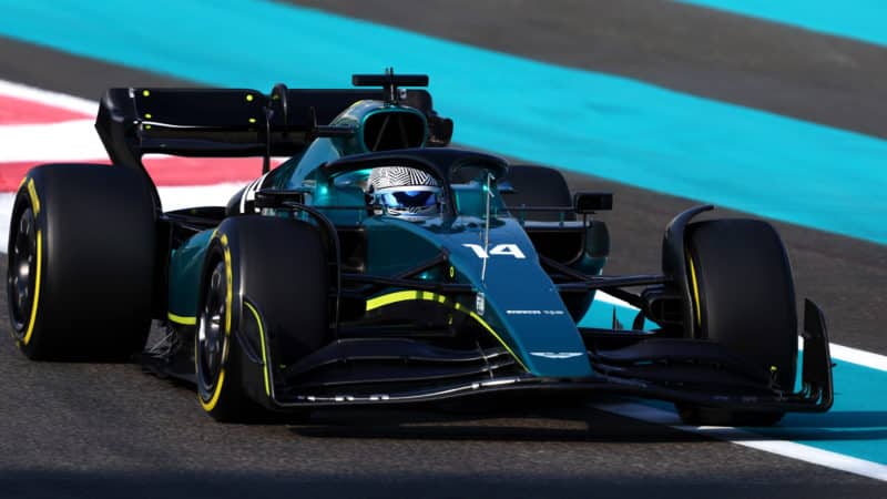 Fernando Alonso on track in unbranded Aston MArtin F1 car at 2022 Abu Dhabi test