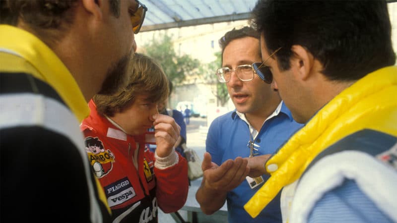 Ferrari-F1-engineer-Mauro-Forghieri-talks-to-Didier-Pironi-