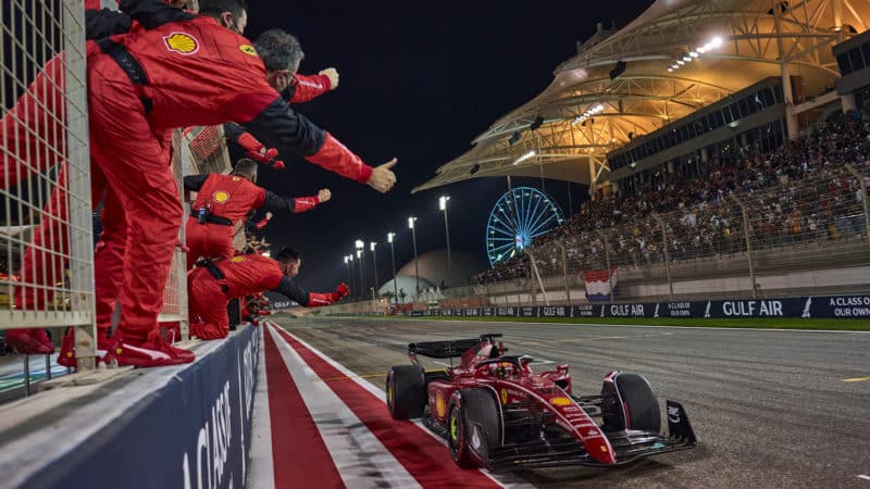 Ferrari team cheer from the pitwall as Charles Leclerc crosses the line to win 2022 F1 Bahrain Grand Prix