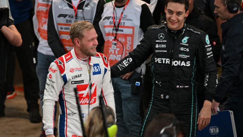 George Russell congratulates Kevin Magnussen on pole position at the 2022 Brazilian Grand Prix