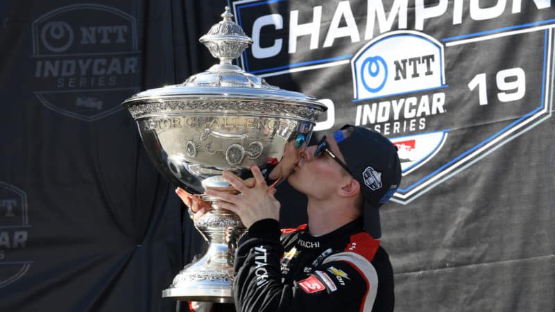 Josef Newgarden kisses the trophy after winning 2019 IndyCar championship