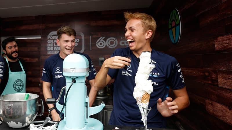Logan Sargeant watches as Alex Albon builds an ice cream ahead of the 2022 Mexican Grand Prix