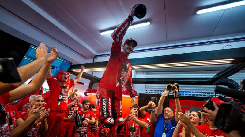 Pecco Bagnaia celebrates winning the 2022 MotoGP championship with Ducati team