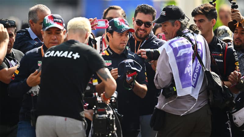 Red-Bull-F1-driver-Sergio-Perez-surrounded-by-fans-at-the-2022-Mexico-GP