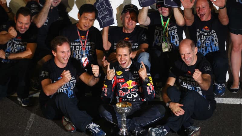 Sebastian Vettel celebrates winning 2011 F1 championship with Abu Dhabi trophy Christian Horner and Adrian Newey
