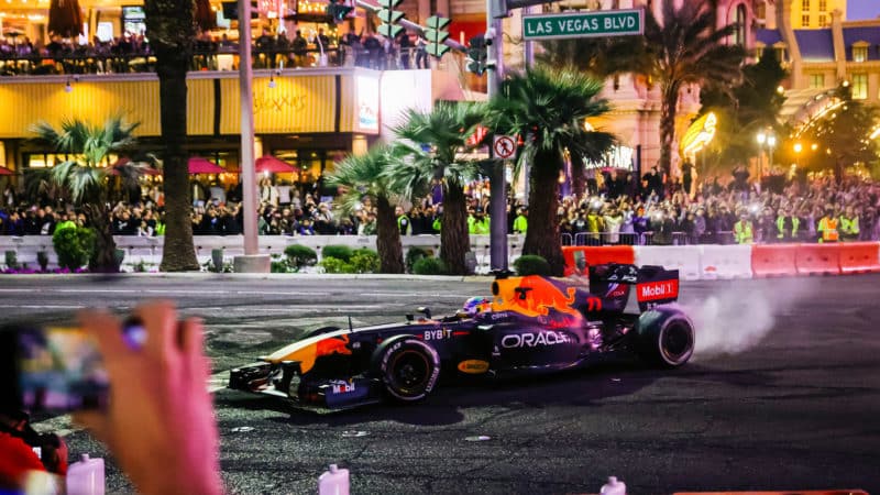 Smoke pours from the tyres of Sergio PErez Red Buyll at Las Vegas Grand Prix launch party