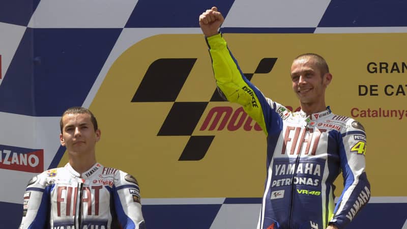 Valentino-Rossi-celebrates-2009-Barcelona-MotoGP-win-on-podium-with-Jorge-Lorenzo