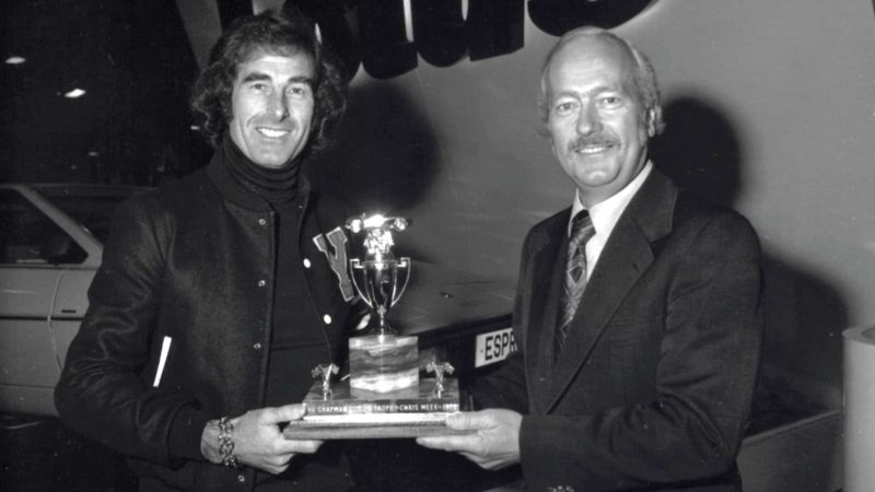 Colin Chapman presents Meek with trophy