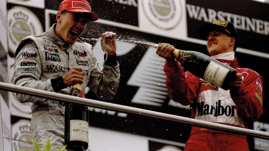 Hakkinen and Schumacher celeberate on the podium
