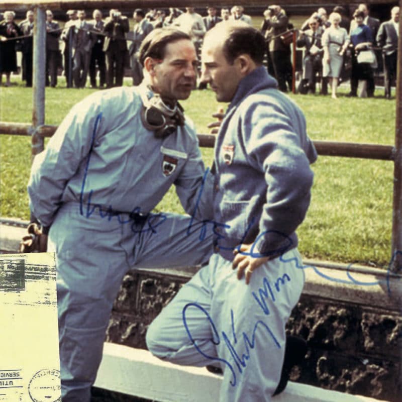 Innes Ireland and Stirling Moss having a chat