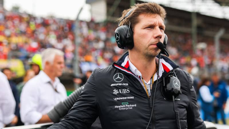 James Vowles in Mercedes top stands on grid ahead of F1 grand prix