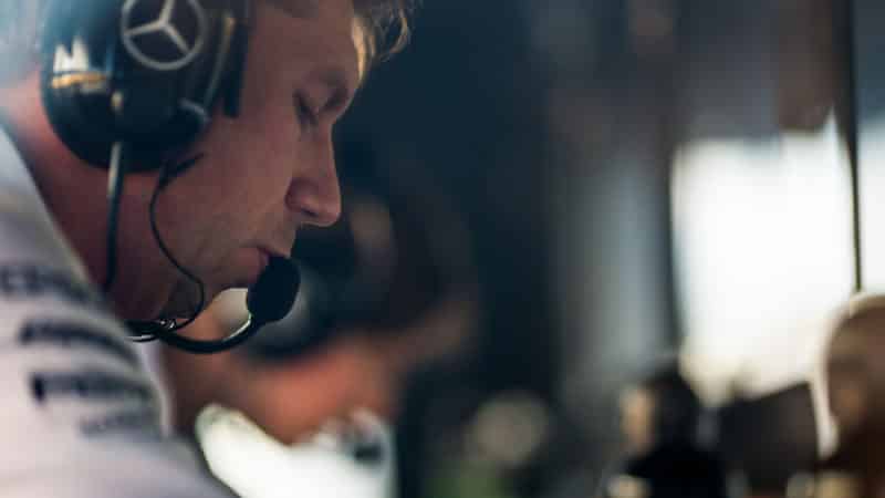 James Vowles with headphones in Mercedes F1 garage