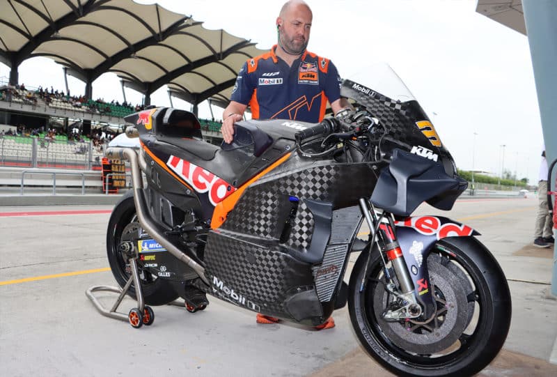 Carbon KTM bike is wheeled in pitlane during 2023 MotoGP Sepang test