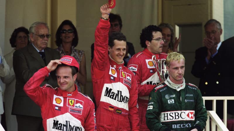 Eddie Irvine on podium with Michael Schumacher and Rubens Barrichello at 2001 Monaco Grand Prix