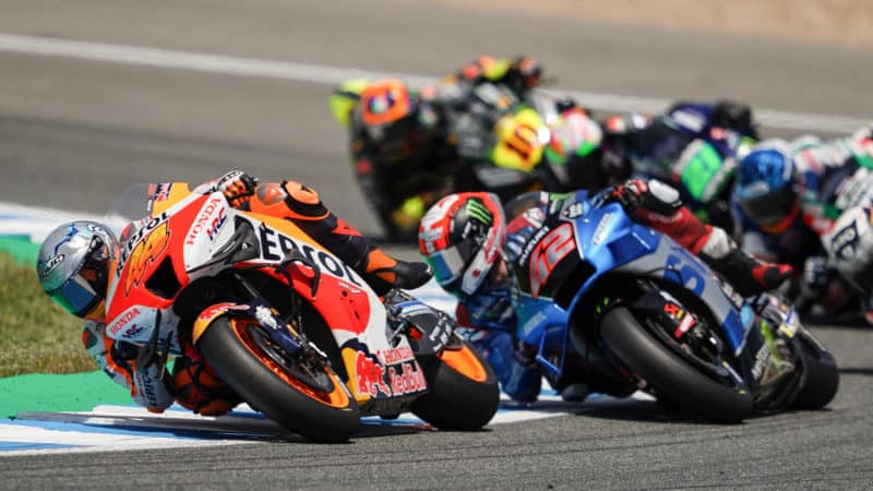 Pack of MotoGP bikes fighting at Jerez in 2022