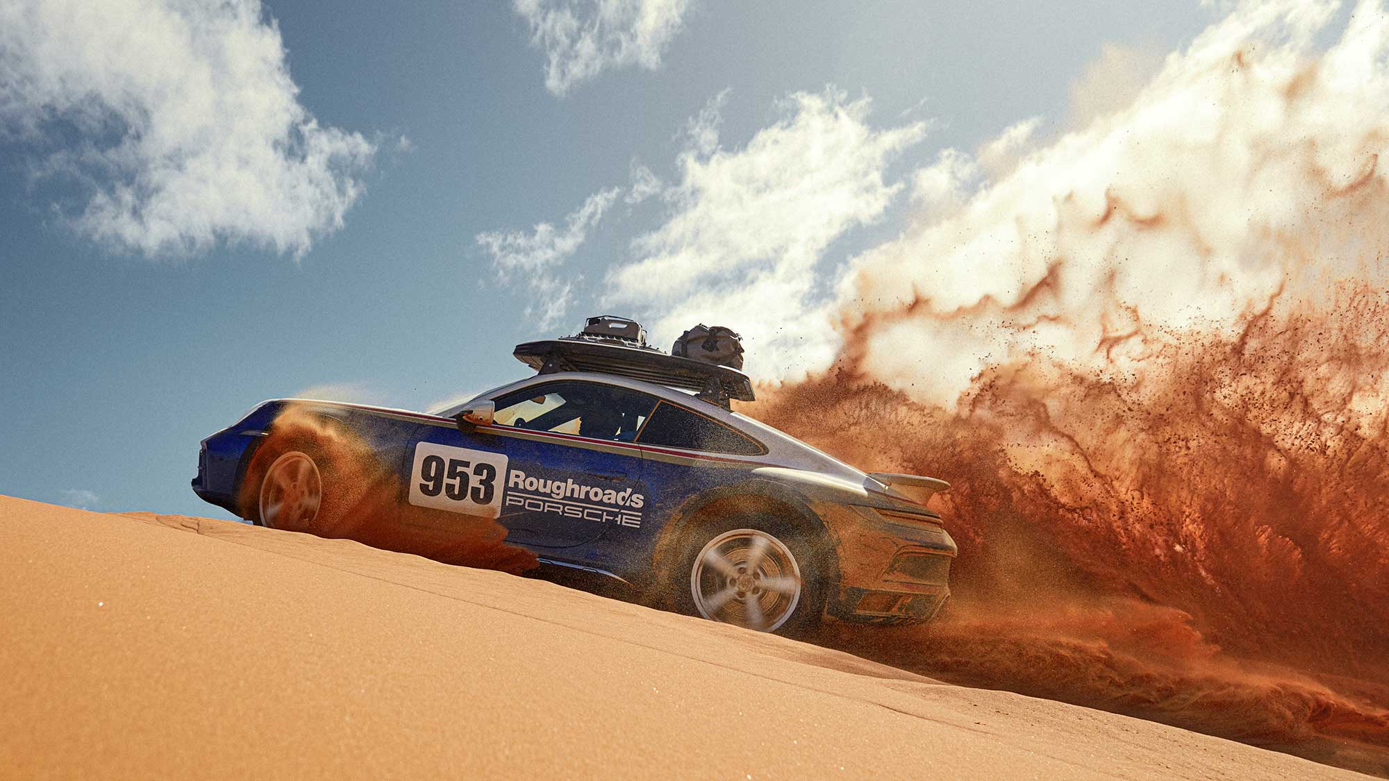 Porsche 953 up hill in the desert