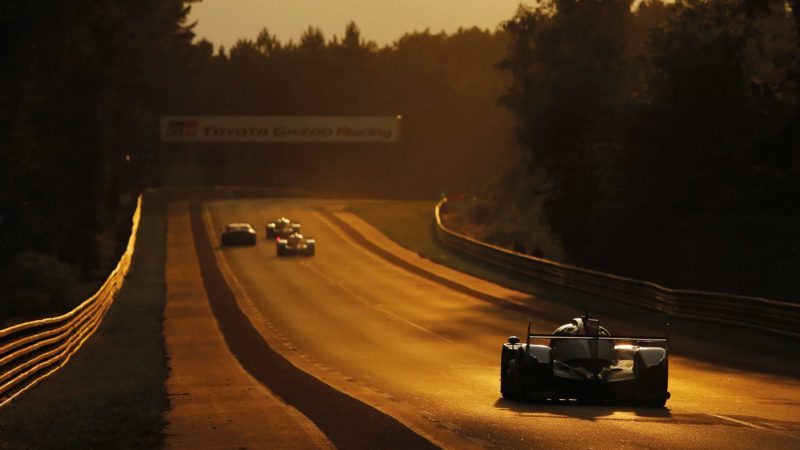 4 cars speed down Mulsanne in the early evening